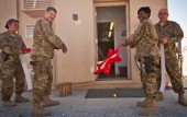 Military personnel celebrate the installation of an Armag Arms Vault / Armory