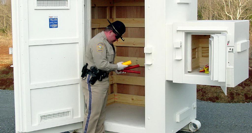 A police officer storing explosives in an Armag magazine.