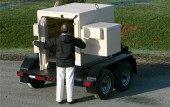 Trailer mounted magazine with attached cap box.