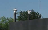 Rear vent stacks mounted on an earth covered magazine.
